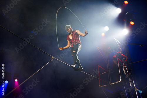 Bild auf Leinwand Circus performance of aerial acrobats-tightrope walkers