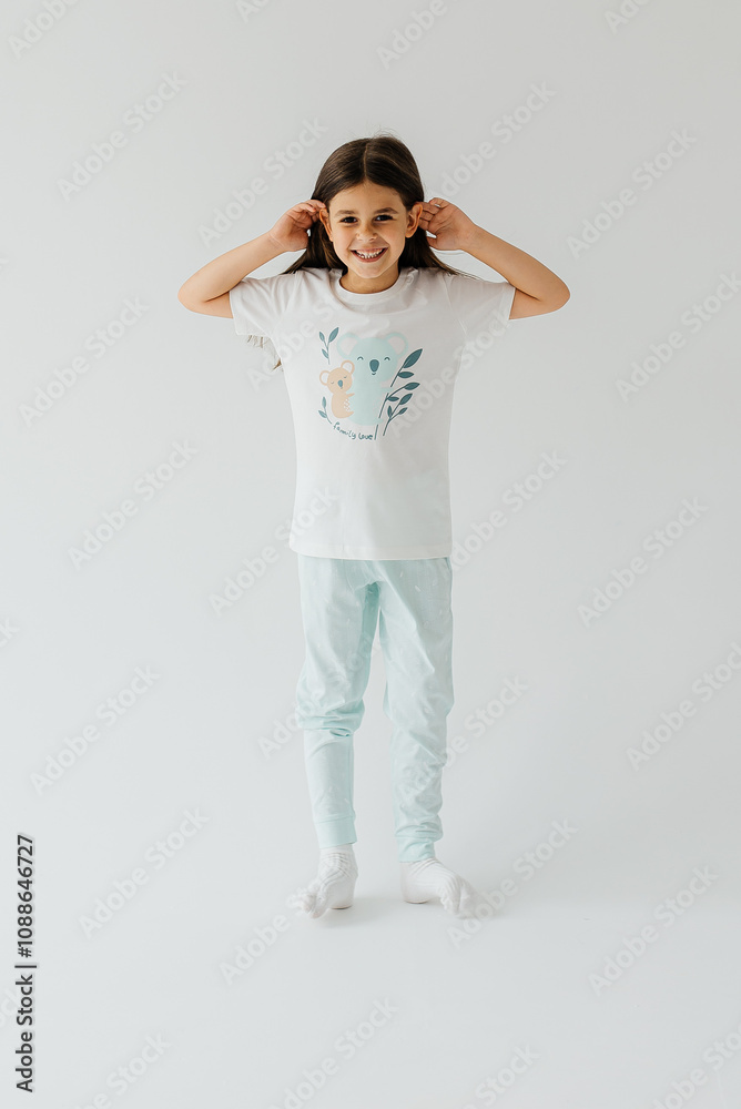 Cute girl wearing pajamas on white background Cute girl wearing pajamas on white background