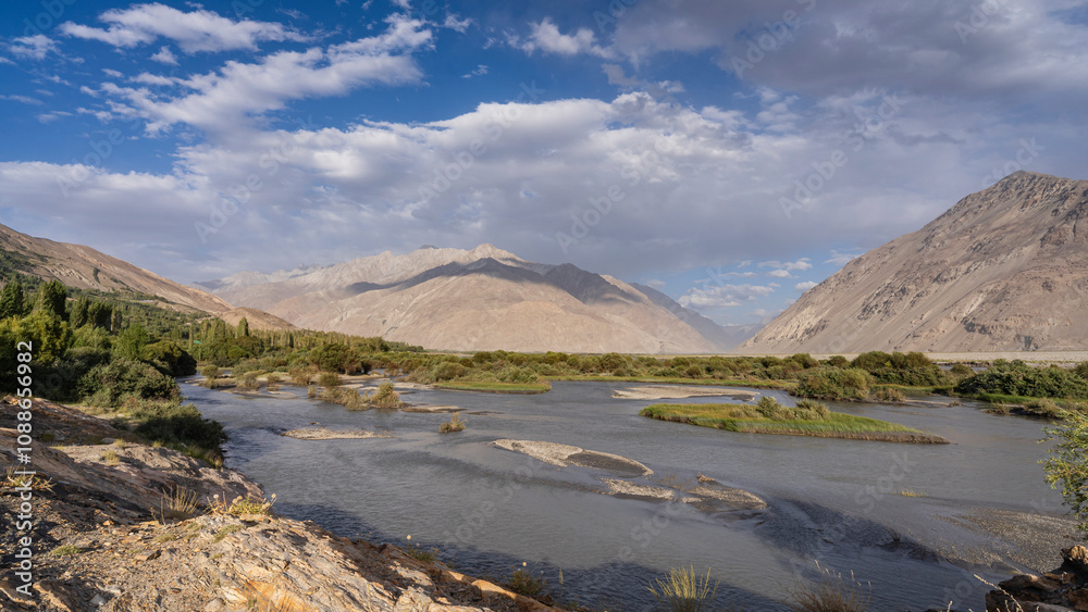 Scenic landscape view before sunset of Panj river valley and Wakhan mountain range in Wakhan Corridor, Langar, Gorno-Badakhshan, Tajikistan Pamir Scenic landscape view before sunset of Panj river valley and Wakhan mountain range in Wakhan Corridor, Langar, Gorno-Badakhshan, Tajikistan Pamir