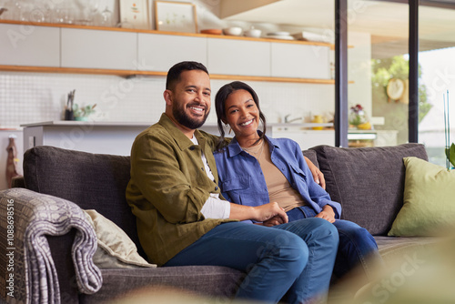 Portrait of loving smiling mixed race couple at home