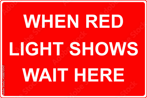 When red light shows wait here road sign