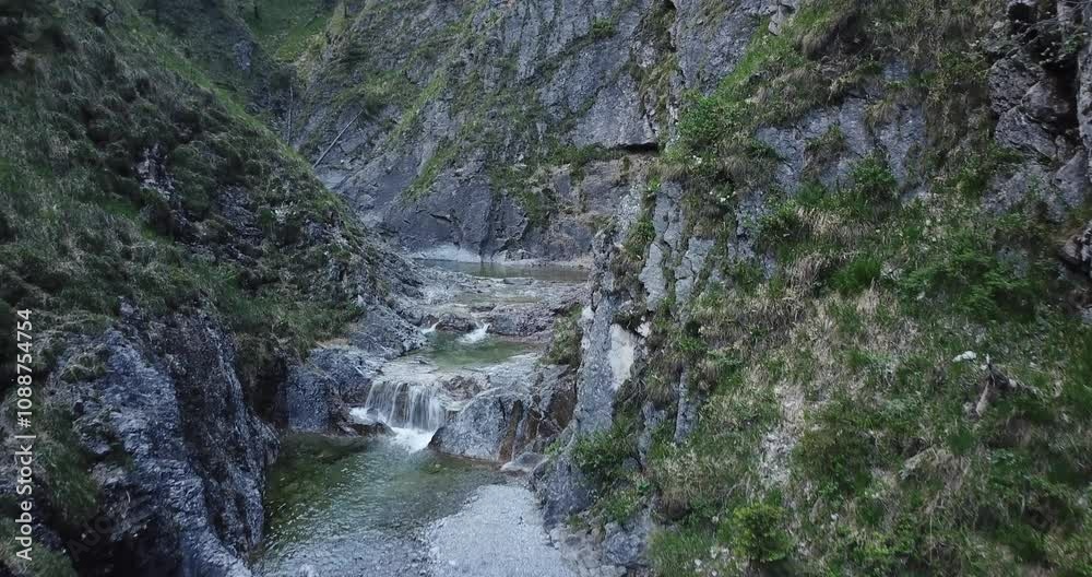 Aerial view, Drone flight over a river between mountains in a forest in Bayern, Germany Aerial view, Drone flight over a river between mountains in a forest in Bayern, Germany
