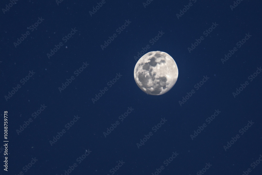 Obraz premium The moon and sky in nature at night. Light landscape concept. A full moon with a big dark sky at night. A full moon in the dark with a big cloud in the sky at lifestyle night.