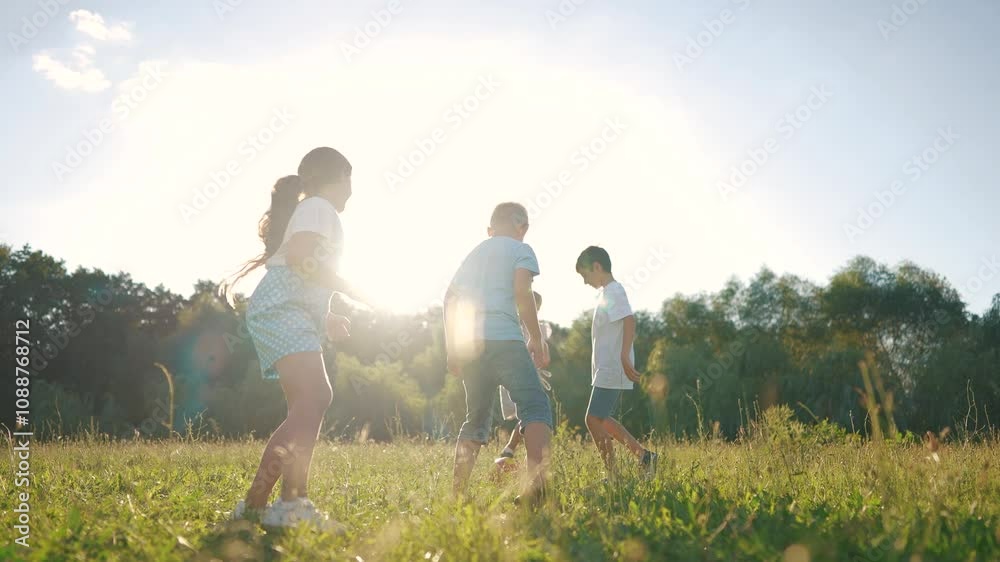 children playing ball in the park. a group of children playing ball at sunset in nature. happy family kid dream concept. children lifestyle playing soccer in the park in nature