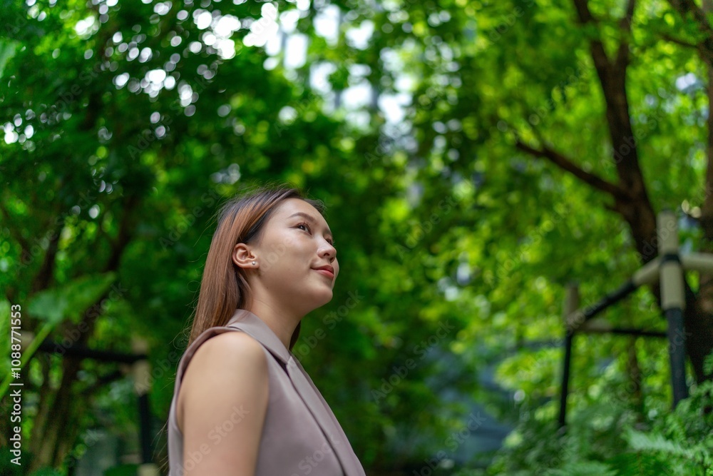 Portrait of a Young Businesswoman Amid Greenery and Tree in A Public Park Portrait of a Young Businesswoman Amid Greenery and Tree in A Public Park