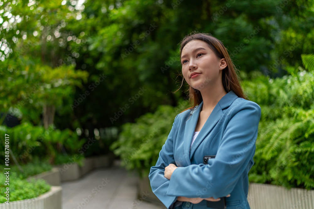 Portrait of a Young Businesswoman Amid Greenery and Tree in A Public Park