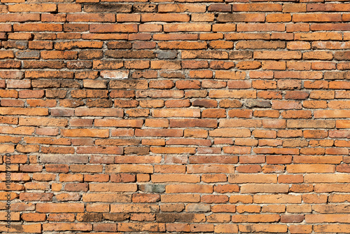 Weathered Orange Brick Wall Close-Up.