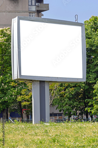 Obraz na plátne Empty Large Advertising Billboard in City Park Copy Space