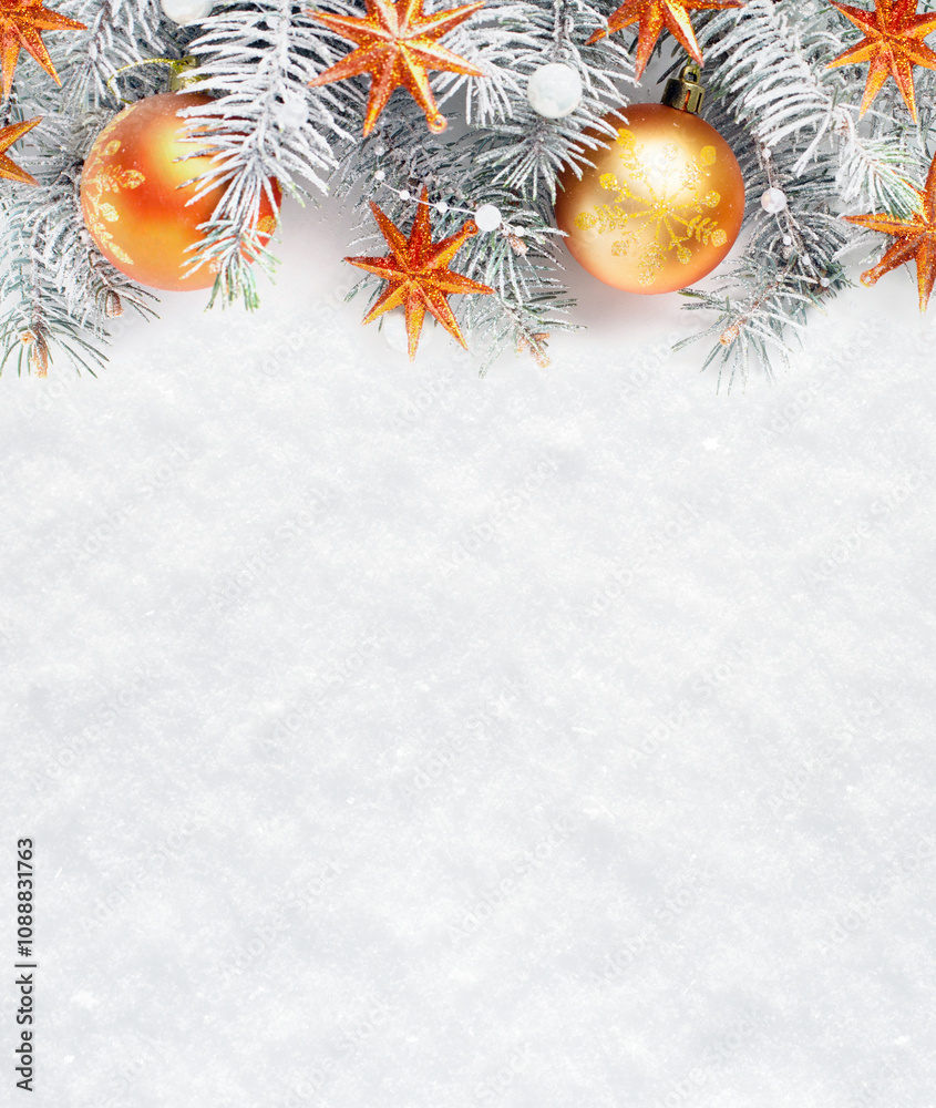 Christmas tree branches with decorations on the background of natural snow with empty space for text. Flat lay. Christmas and New Year background.