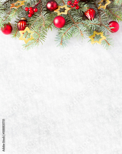 Obraz na płótnie Fir branches with Christmas ornaments on the background of natural snow with empty space for text. w salonie