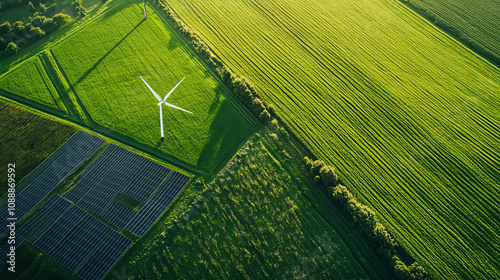 Wind turbines and solar panels in a green field provide clean energy.  These are important for a sustainable future.