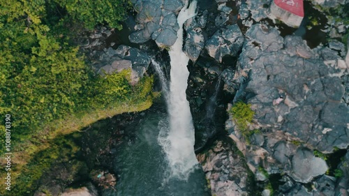 Bird's view of the amazing Tegenungan Waterfall in tropical rainforest jungle, Bali, Indonesia.  photo