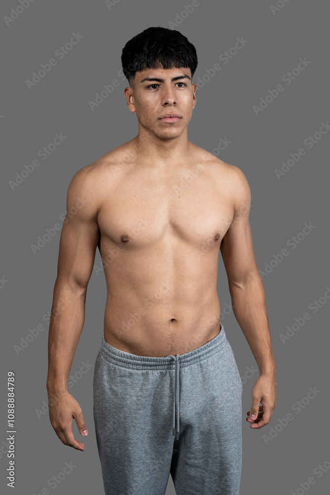 Young latino athlete showing his fit body after workout Young latino athlete showing his fit body after workout