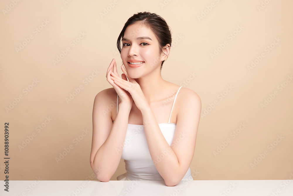 Beautiful young asian woman with clean fresh skin on beige background, Face care, Facial treatment, Cosmetology, beauty and spa, Asian women portrait. Beautiful young asian woman with clean fresh skin on beige background, Face care, Facial treatment, Cosmetology, beauty and spa, Asian women portrait.