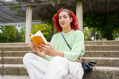 Peaceful moment with trans woman reading in the park photo