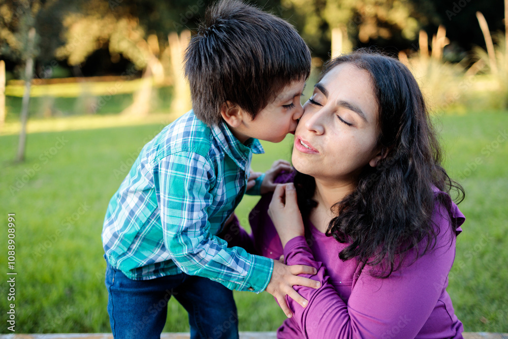 Tender moment in the park between latin mother and son Tender moment in the park between latin mother and son