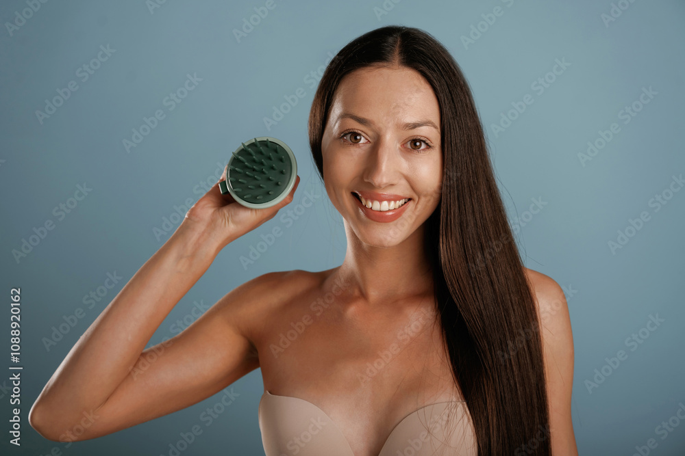 Young woman is in the studio against background Young woman is in the studio against background