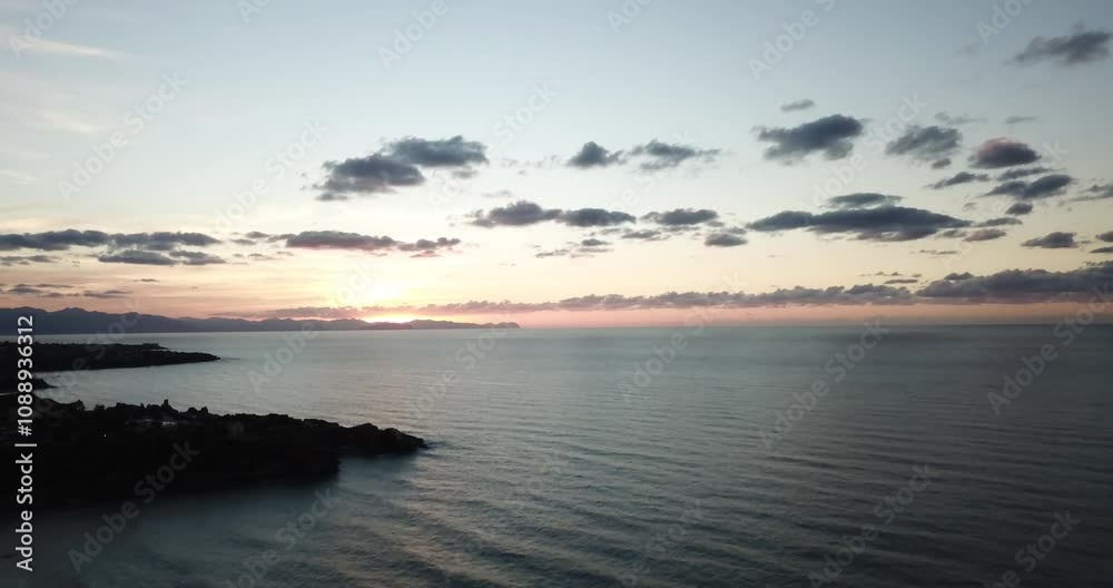 Aerial view, drone flight over sea in a beautiful sunset on the beach in Sicily, Italy Aerial view, drone flight over sea in a beautiful sunset on the beach in Sicily, Italy