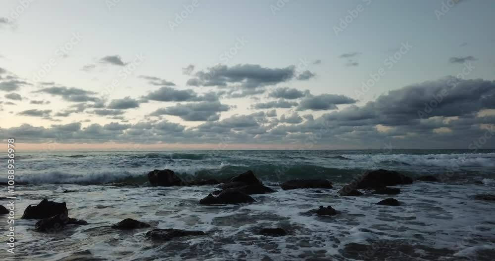 Aerial view, drone flight over beautiful beach with waves crashing on the beach in Sicily, Italy Aerial view, drone flight over beautiful beach with waves crashing on the beach in Sicily, Italy