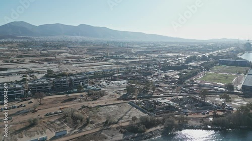 Aerial footage of a big, huge construction site in Athens, Greece, building, road, cranes, engineer, architecture developing photo