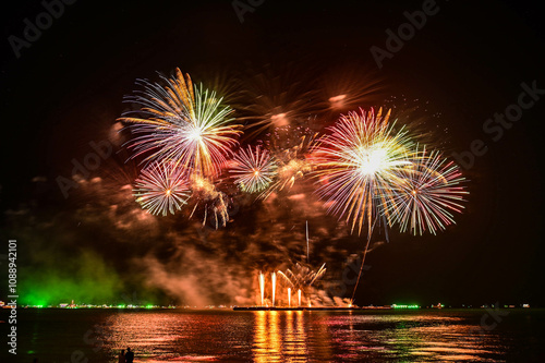 Beautiful fireworks set off in the middle of the sea.