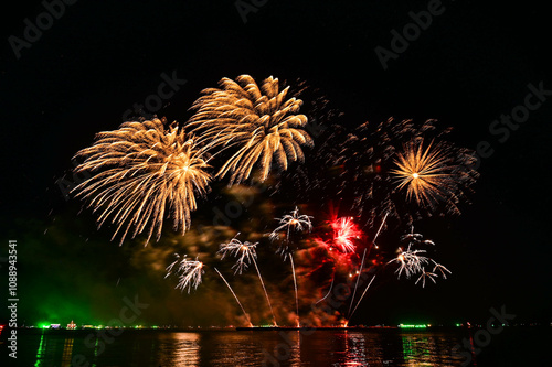 Beautiful fireworks set off in the middle of the sea.