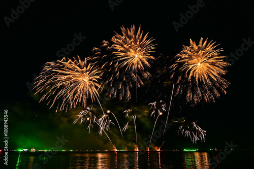 Beautiful fireworks set off in the middle of the sea.