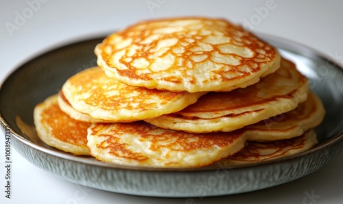 Traditional Polish potato pancakes arranged in a stack on a plate , placki ziemniaczane, placki, polish cuisine