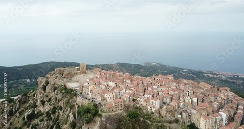 Aerial view, drone flight over Pollina, beautiful town on top of the mountain in Sicily, Italy