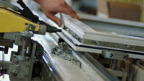 Windows production, manufacture. Semi-automatic factory line. Close up.