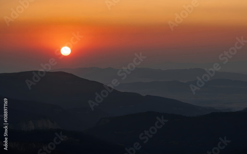 Sunset Over Silhouetted Mountains