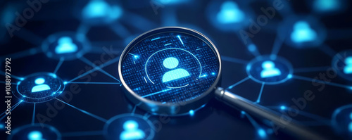 Magnifying glass focusing on a user profile icon, representing talent search, recruitment, and personal data analytics in a digital network