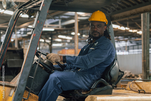 Industrial worker indoors in old factory. Industrial man Engineers in Hard Hats.Work at the Heavy Industry Manufacturing Factory.