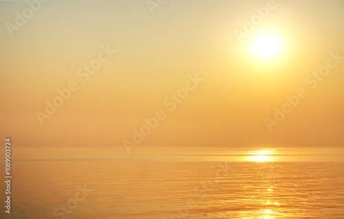 landscape,The beautiful yellow sky in the evening after sunset reflects the sea.
