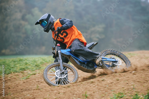 Downhill on an electric motorcycle during a motocross competition