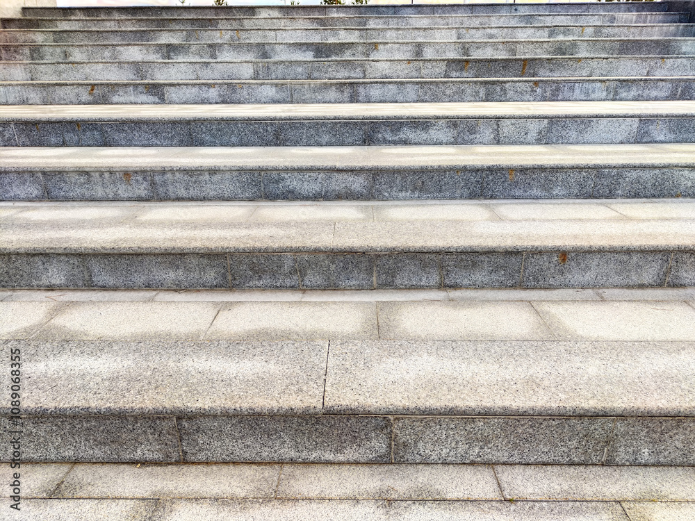 A series of neatly arranged stone steps provide access to the entrance of a modern building, showcasing a minimalist aesthetic A series of neatly arranged stone steps provide access to the entrance of a modern building, showcasing a minimalist aesthetic