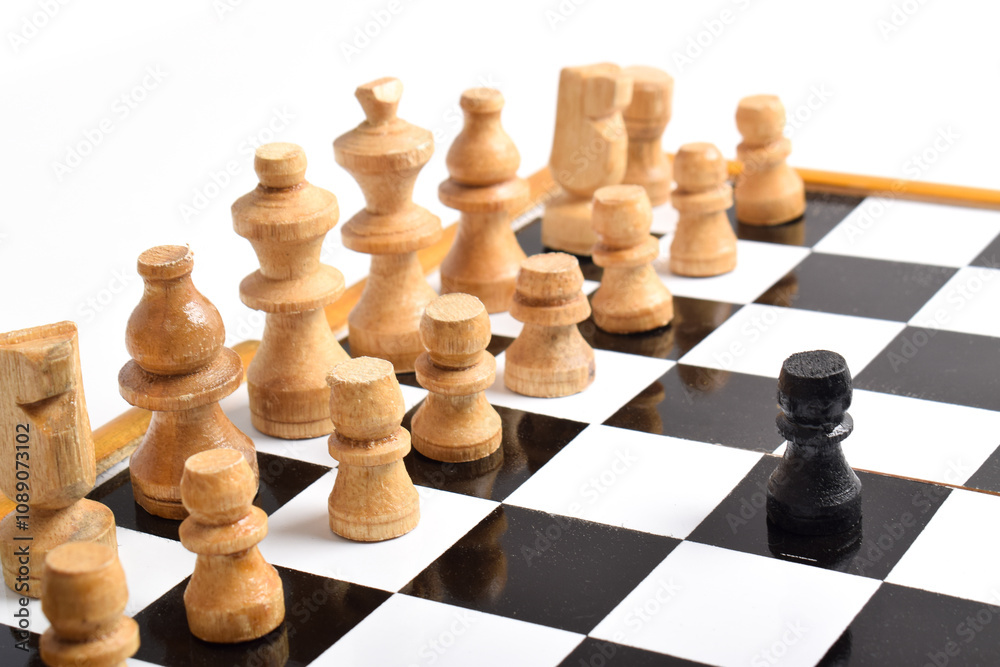 Black chess pawns facing row of white chess pieces. Black chess pawns facing row of white chess pieces.