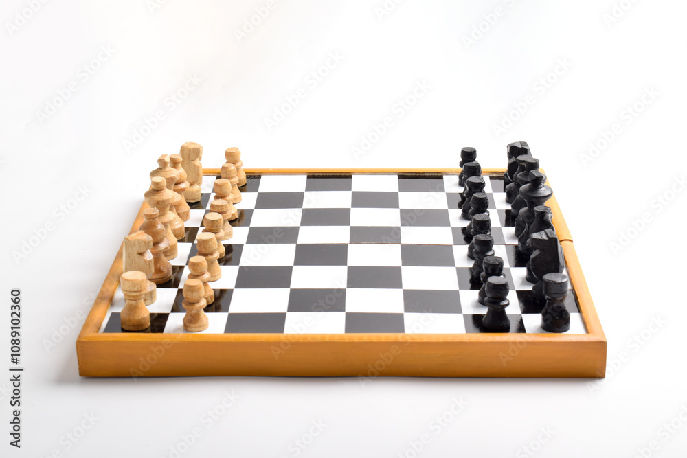 Wooden chessboard with chess pieces ready for the game isolated on white background Wooden chessboard with chess pieces ready for the game isolated on white background