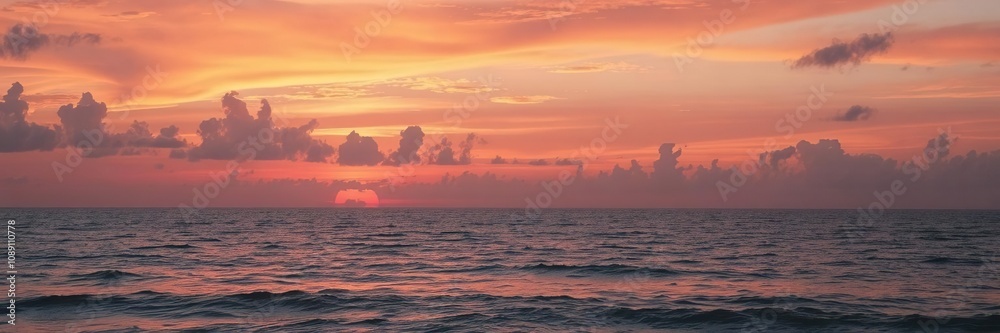 Fototapeta premium Vibrant and mesmerizing sunset casting hues of orange, pink, and purple over the tranquil ocean, ocean, dusk, picturesque