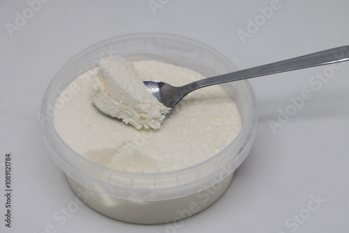 Turkish dairy product kaymak in plastic bowl, 2 photo