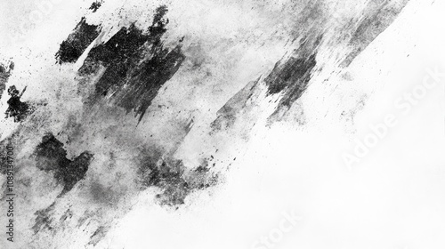 Abstract grunge texture created with graphite pencil on a white background, showcasing dark smudges and dynamic brushstroke effects. photo