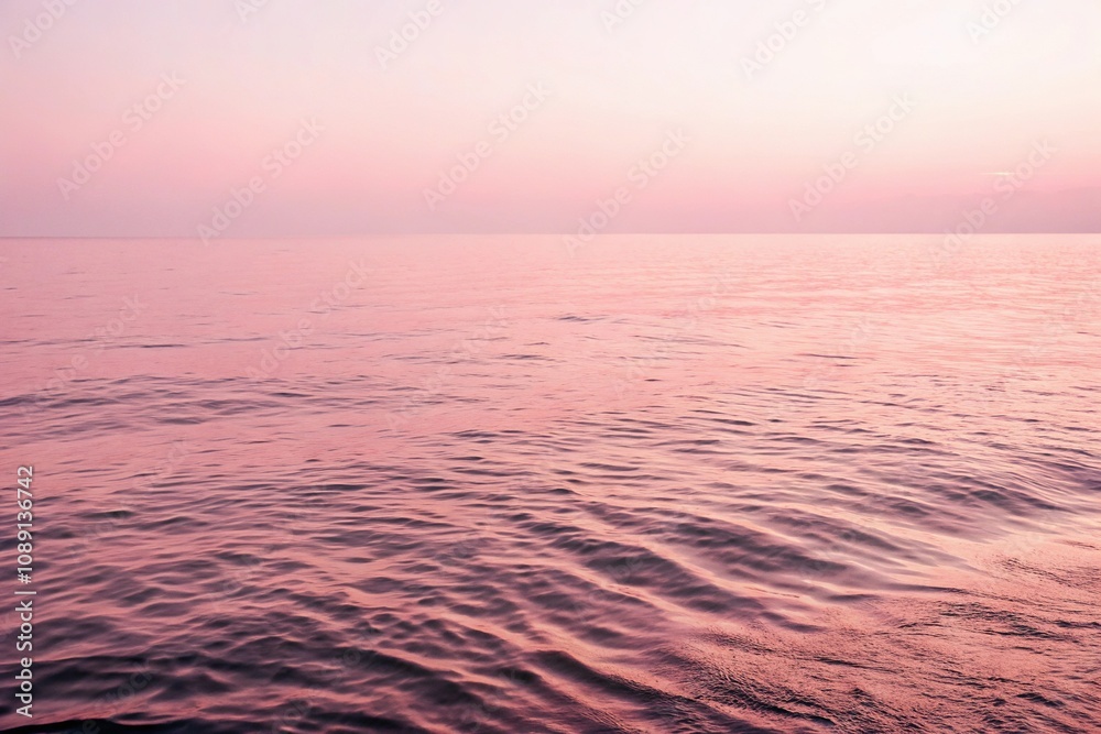 Obraz premium Gentle pink ripples in the sea create a soothing atmosphere, ripples, atmosphere, nature, peaceful, calming