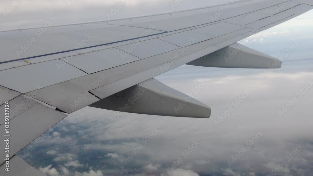 from airplane wing flying between clouds perspective adds to associated air travel exploration close up view mesmerizing experience close-up excitement 