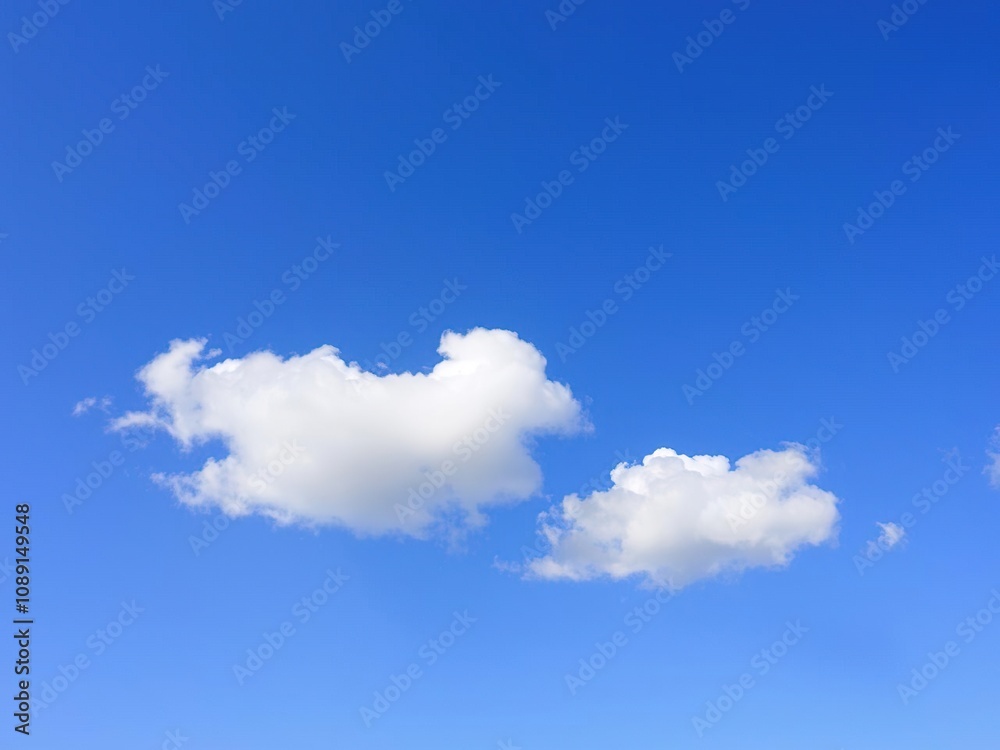 Soft white clouds float gently on a brilliant blue sky with fluffy texture and subtle shading, clouds, soft focus, cloud formations Soft white clouds float gently on a brilliant blue sky with fluffy texture and subtle shading, clouds, soft focus, cloud formations