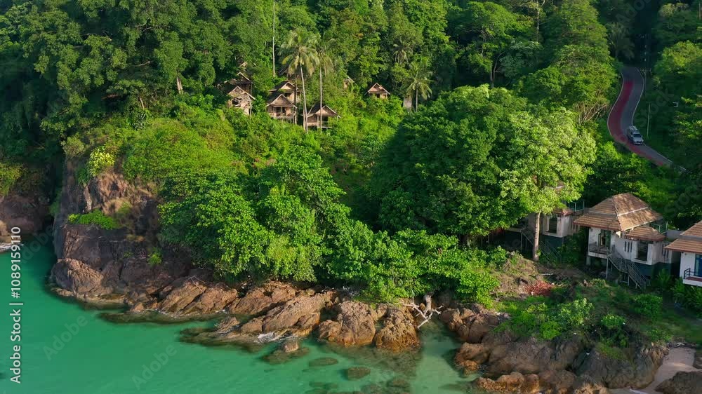 Beautiful morning view coastline tropical beach Thailand on background tropical rainforest jungle and blue sky. Lonely Beach, Koh Chang, Thailand Beautiful morning view coastline tropical beach Thailand on background tropical rainforest jungle and blue sky. Lonely Beach, Koh Chang, Thailand