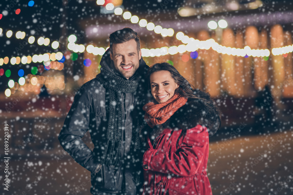 Photo of two sweethearts pair in love attending city park at newyear midnight frosty weather standing close wearing warm winter jackets outdoors Photo of two sweethearts pair in love attending city park at newyear midnight frosty weather standing close wearing warm winter jackets outdoors