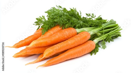 Photograph of a pile of carrots with green tops in a bundle. 