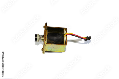 Gas geyser coil solenoid valve of gas water heater, maintenance and repairing home appliances concept, a solenoid valve is an electromechanically operated valve that opens for the gas to pass photo