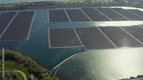 Aerial shot of the largest solar panel farm floating on a lake, Orange, France