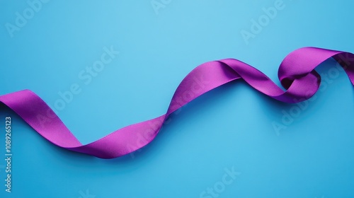 A beautifully knotted purple ribbon elegantly twisted against a vibrant blue background, showcasing smooth texture and vivid colors.